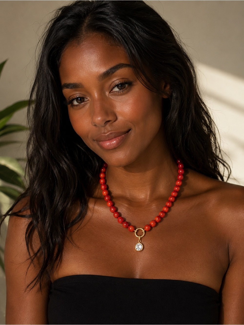 Vibrant Red Beaded Necklace with Gold Accent and Crystal Charm
